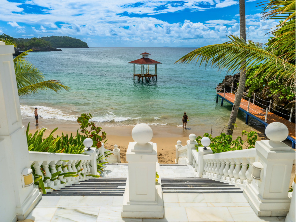 TourCert Journal Blog Hotel Domenican Republic View of a beachfront hotel in Samaná, showcasing the region's commitment to sustainable tourism while preserving its natural beauty